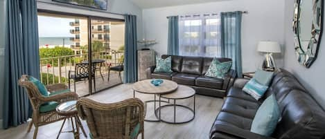 Living Room Offers Access to Balcony with Partial Gulf Views