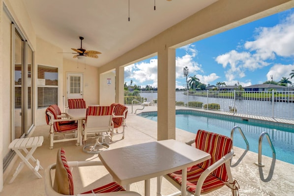 You can enjoy dining outdoors under the covered lanai, with the pool and canal as your back drop. A grill is provided for you, as well!