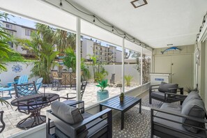 The screened in lanai features some shade after a long day at the beach or pool