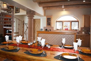 Looking into open kitchen from dinner table