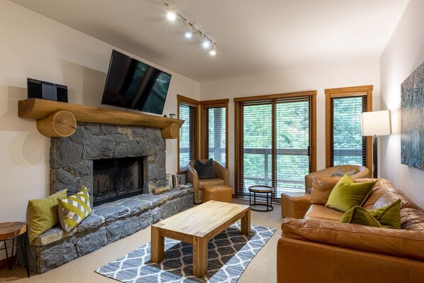 Living area: Wood burning fireplace, TV, accss to private patio