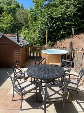 Terrace with wood fired hot tub and outdoor seating