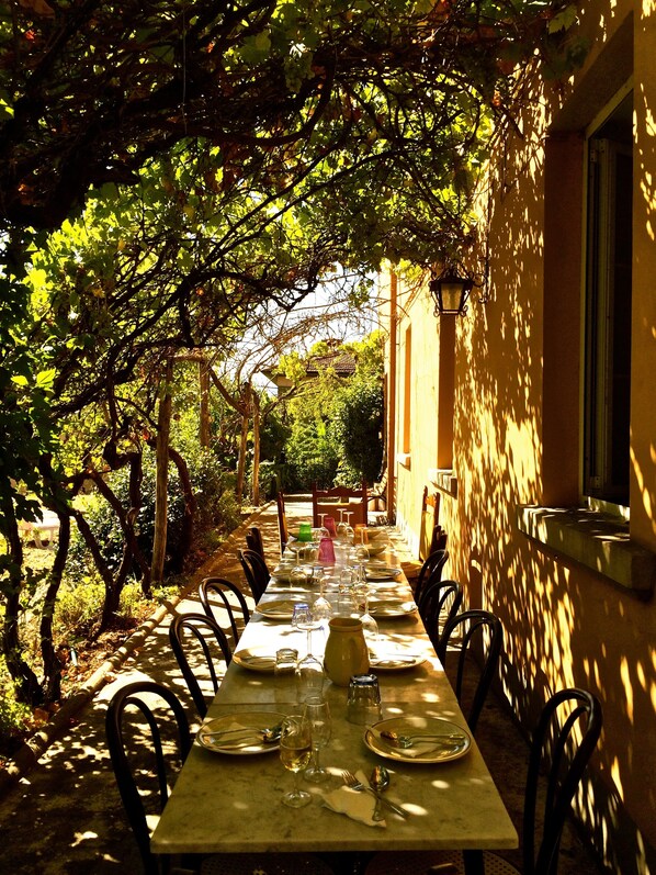 marble tables in the garden set for a relaxing al fresco lunch