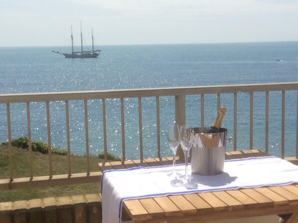 Front balcony with stunning views, dining table, chairs and quality sunloungers