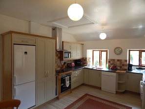 Well equipped kitchen overlooking the garden