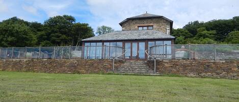 The vast patio at is made safe with toughened glass and hand carved balustrade