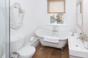 Bathroom with roll top bath