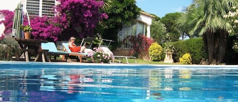 Relax by the large heated salt water pool