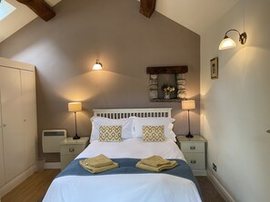 Comfortable double bed with high quality linens and towels