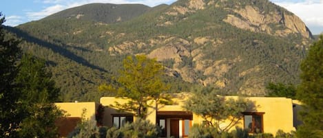 Exterior front view with Taos Mountain background