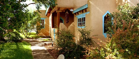 Peaking through wooden gate to front entry