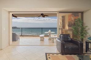 The sliding door to the patio opens to let the beach inside!