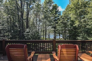 Sit among the trees and soak up in the warm sunlight as you overlook the lake on the back deck.