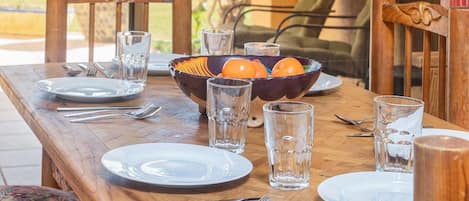 Dining table right by the patio door lets you enjoy the beauty outdoors.