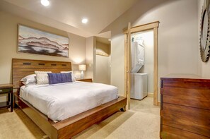 View of bedroom and washer/dryer from entryway