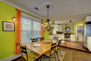 Dining Area with Natural Light – St. Simons Beach Rental - Gather for shrimp and grits or late-night card games in this bright, cheerful dining space. Big windows and bold colors keep the energy high, just like the island outside your door.