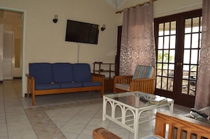 Living area with open plan layout from kitchen.