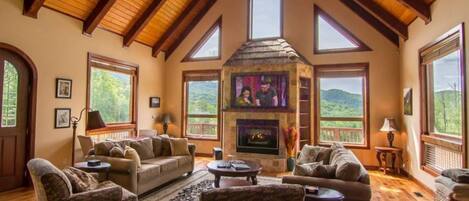 Living room with TV and fireplace