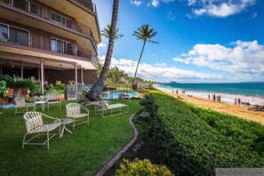 Front lawn area with lounge chairs by the pool/ocean