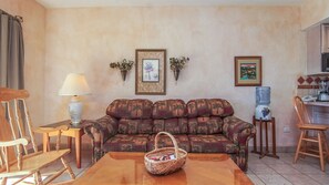The living room features custom faux finish on the walls.