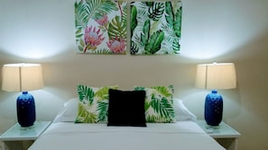 Caribbean inspired bedroom retreat with queen size beds