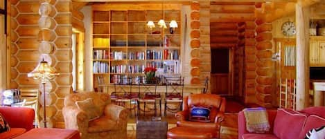 Main House:
Log Home view from living room fireplace to dining table