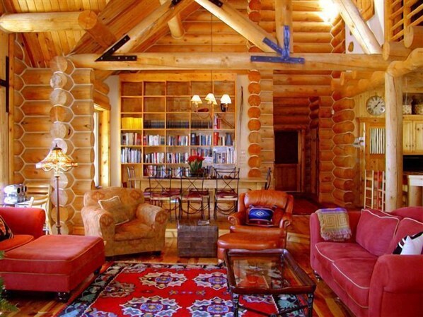 Main House:
Log Home view from living room fireplace to dining table