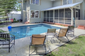 private heated pool and patio at rewind on 11th - Your own backyard oasis with a heated pool, screened porch, and plenty of room to lounge or gather.