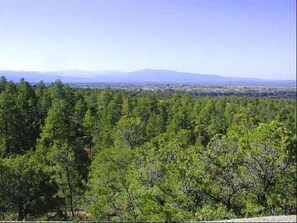 Majestic 2nd story views look south, east and west from over the adobe wall on the roof top deck