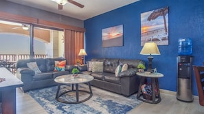 colorful living room set by the sliding patio doors