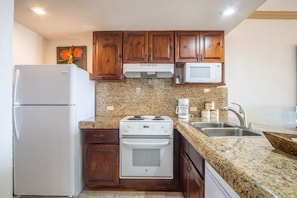 granite counter tops predominate in the kitchen