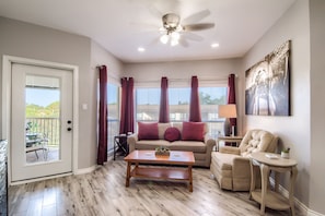 Beautifully Redone Living Room with a Sofa Sleeper.