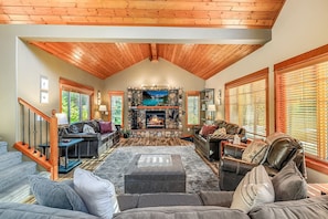 Boasting an open-concept design, this mountain home living room is perfect for entertaining