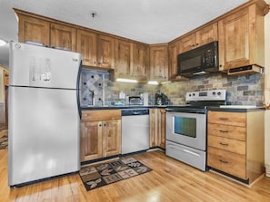 Remodeled kitchen is fully-equipped with pots, pans & utensils.