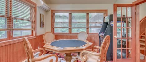 Game Room with a Poker Table and Arcade Cabinet.