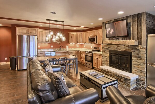 Living Area - Picture of when you first walk into the condo and see the beautiful living room and dinning room areas with a view of the fireplace