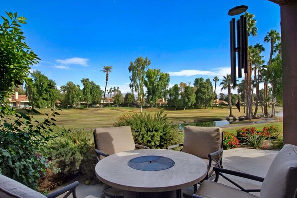 Seating for 4 on the back patio with fire table, BBQ, and great views to the Northeast