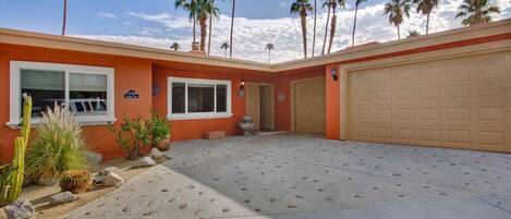 entrance to the home.  Parking for two cars in the garage, and a golf cart available to guests.