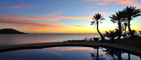 Pool with beautiful ocean view at sunset