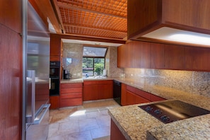 Kitchen with Cooktop, Refrigerator, Dishwasher, and Coffee Maker