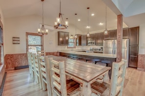 Kitchen with Table, Chairs, and Refrigerator at our Poconos Luxury Rental