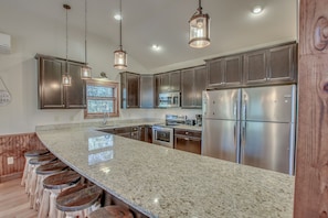 Kitchen with Appliances and Bar Seating