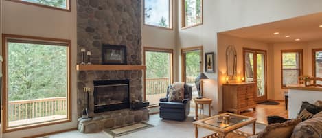 Mt Hood Retreat great room - Great room with vaulted ceilings, stone fireplace and great of the outdoors