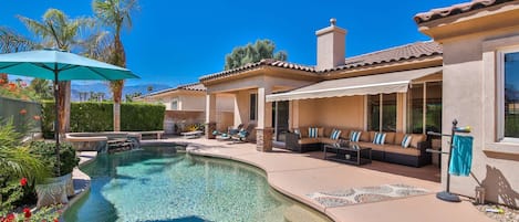 Gorgeous backyard with pool, spa, fire table, BBQ, lounging, and mountain views!