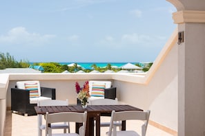 Huge terrace with ocean views. Comfy chairs, al fresco dining and sun lounger