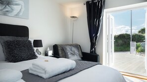 MASTER BEDROOM with French doors to outside.