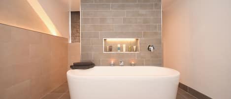Family luxury bathroom. deep tub, walk in shower, rad, towel rad, WHB & WC