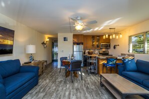 The Main Room:  kitchen adjacent the livingroom, two lush sofas.