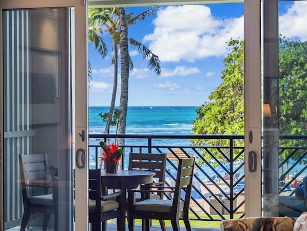 Ocean and beach view lanai! - Watch the whales breach from your lanai! There is a dining table with 4 chairs, a chaise lounge, and a side table