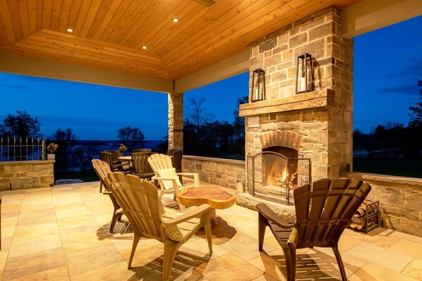 At Loyalist House enjoy the covered patio with a wood burning fireplace!